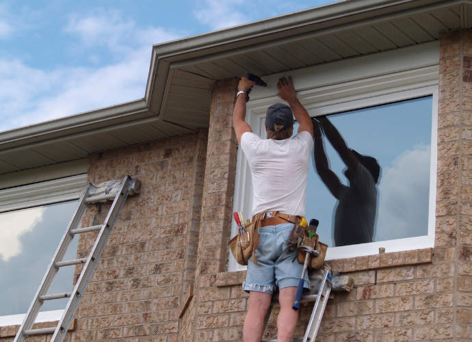 man putting in new window